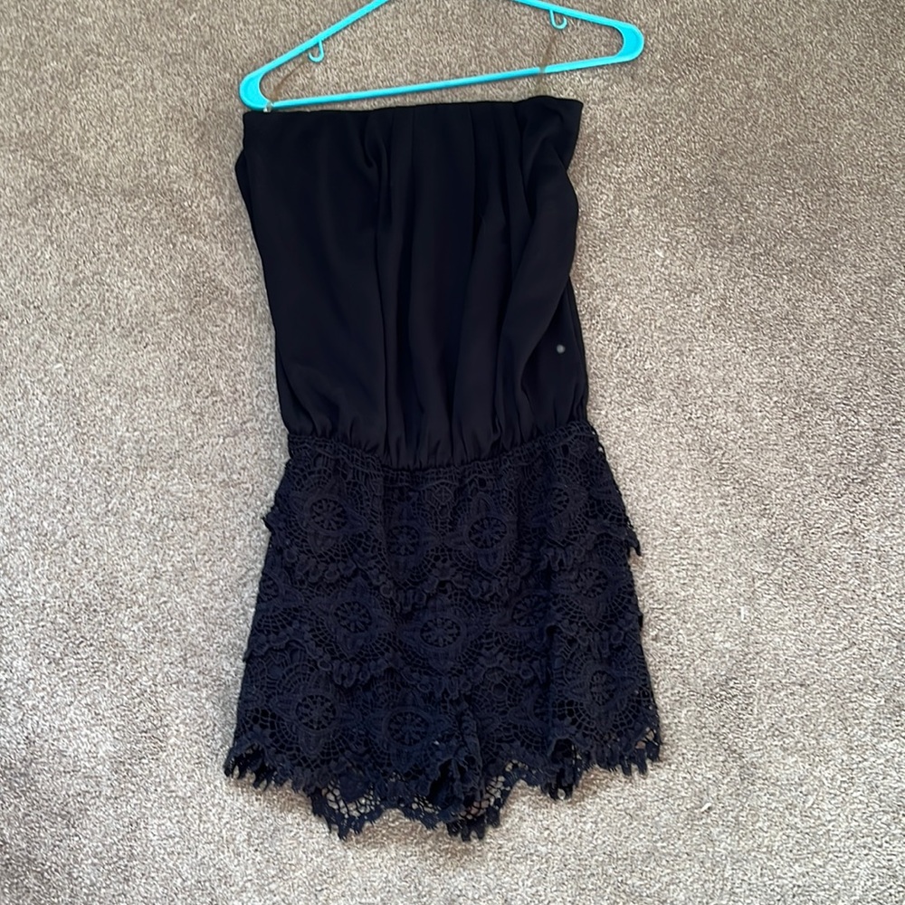 Strapless black romper with lace shorts